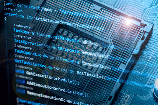 Information technology concept. Coding programmer language script text on screen monitor display with a PC keyboard and processor socket. Programmer occupation job.