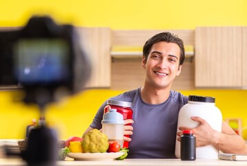 Young man blogging about food supplements