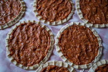 Top view of homemade pide, turkish flatbread with ground meat, mini pita breads or mini turkish pizzas