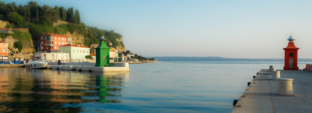 Tilt Shift Photography Red And Green Lighthouses In Piran