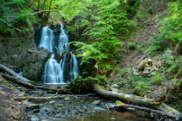 Fototapeta premium Forsakar Waterfall Stunning Slow falling Water near Degeberga in lush rural Forest in Skane Osterlen, South Sweden. Many steps Long Exposure Waterfall.