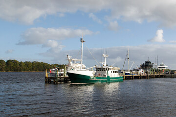 Fishing boats moored in Strahan Harbor on the west coast of Tasmania.