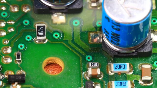 Overloaded electronic circuit causes electrical short and fire. it starts giving off noxious fumes. They could also have come from the epoxy circuit board or possibly a small amount from a melting com