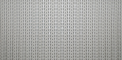 White plastic knitted pattern. Background. Closeup