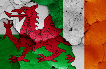 flags of Wales and Ireland painted on cracked wall