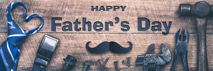 "Happy Father's Day" Message On Wooden Background With Tools, Belt Buckle And Heart Shaped Neck-tie