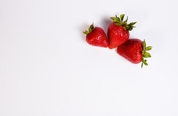 delicious strawberries ready to eat on white background
