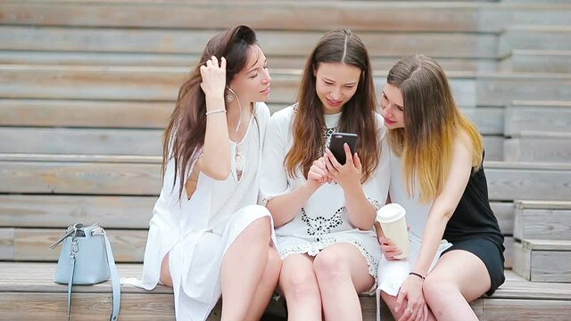 Lifestyle selfie portrait of young positive girls having fun and making selfie. Concept of friendship and fun with new trends and technology. Best friends saving the moment with modern smartphone