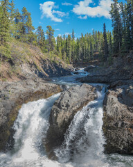 Stunning double split waterfall in British Columbia, northern Canada. Taken in the spring time outside of Atlin near the Yukon Territory border. 