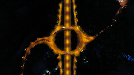 wide angle aerial view of motorway junction day and night