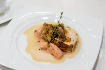 Baked meat with rosemary and sauce. People making meal together awaiting guests. Concept of home cooking healthy food.