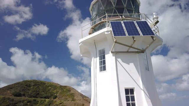 4K bottom to top tilt pan motion of the lighthouse at the tip of Cape Reinga being the furthest northern point on the North Island of New Zealand,the lighthouse and cape is a famous tourist attraction