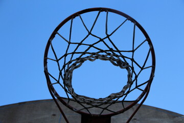 basketball hoop against blue sky