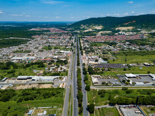 Obraz premium Aerial drone view of gated communities outside Guayaquil City, Ecuador and the main highway going to Via a la Costa. Shot from over houses and homes.
