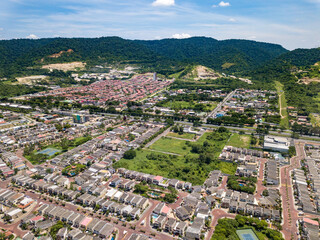 Aerial drone view of gated communities outside Guayaquil City, Ecuador and the main highway going to Via a la Costa. Shot from over houses and homes.