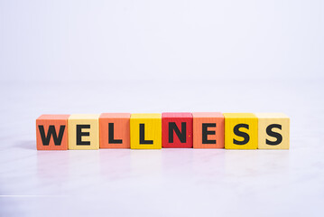 Wellness sign with wooden on white background.