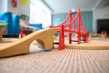 toy wooden railway with red bridge