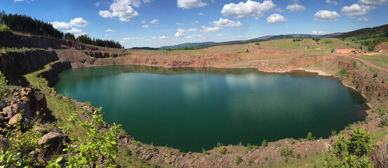the Świerki quarry, Poland. A lake with beautiful crystal-clear turquoise water, a steep quarry slope © Wiktoria