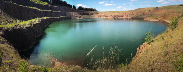the Świerki quarry, Poland. A lake with beautiful turquoise water, a steep quarry slope © Wiktoria