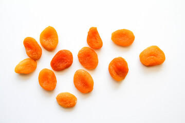 Dried apricots on a white background. Top view.