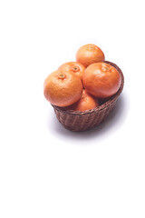 Basket with tangerines on a white background