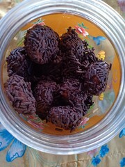 brown meses balls with a yellow background