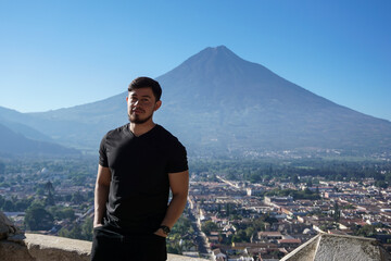 young man on the top of a mountain