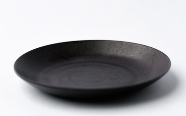 Empty Black plate on white background.