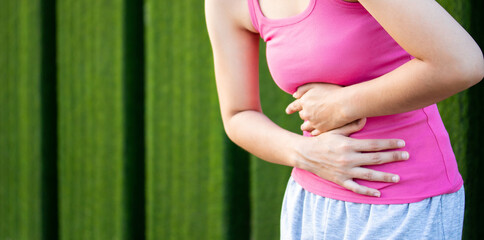 Young woman hands touch on stomach having bad  Food poison  ,Medical concept.