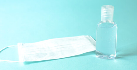 clean white mask with clear alcohol. on blue isolated background, concenpt coronavirus