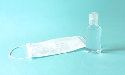 clean white mask with clear alcohol. on blue isolated background, concenpt coronavirus
