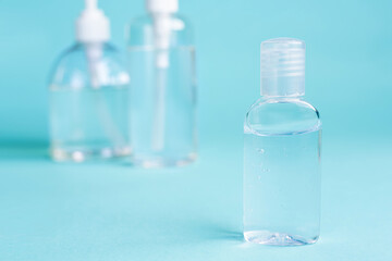 close up small Carry bottle alcohol clean with sanitiser liquid bottle . concenpt protection sanitiser tool protect corona virus on  turqouise isolated background