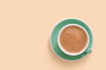 Cup of tasty coffee on color background