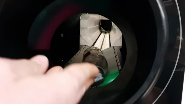 Returning empty recycling bottles in a supermarket close up shot