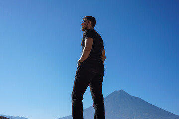 young man standing on the rocks
