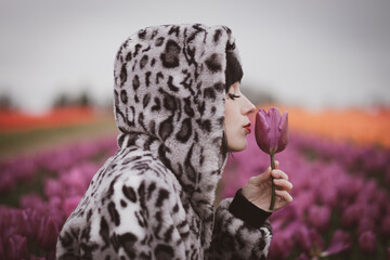 Woman In A Field Of Tulips