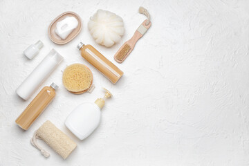 Fototapeta na wymiar Shower gels with bath supplies on white background