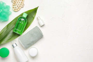 Shower gels with bath supplies on white background