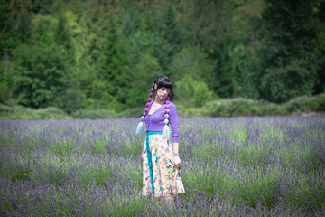 Beautiful Woman Enjoying A Field Of Lavender
