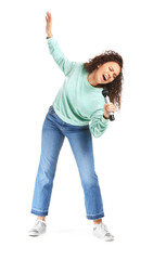 Young African-American woman singing on white background