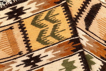 Fragment of Romanian traditional wool carpet design pattern.