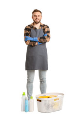 Young man with laundry on white background