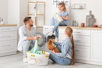 Family doing laundry at home