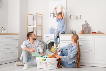 Happy family doing laundry at home