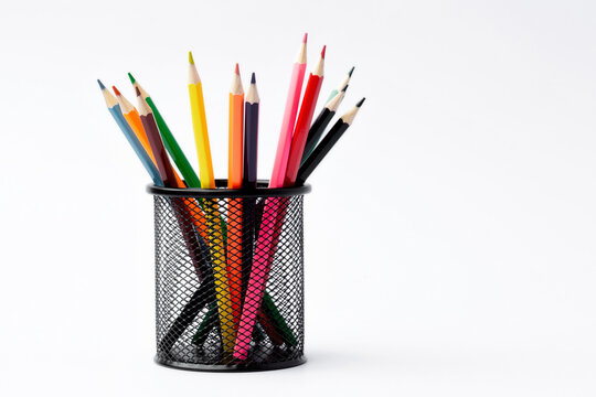 Colored pencils in a pencil case on white background. School concept.