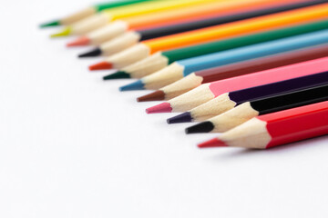 Color pencils on white background.Close up.
