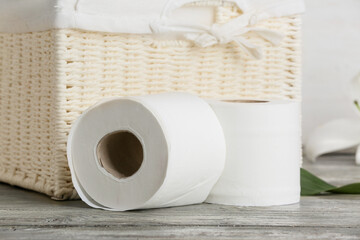 Rolls of toilet paper on table