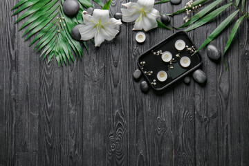 Beautiful spa composition on dark wooden background. Zen concept