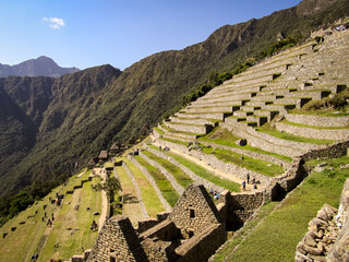 The platforms cultivation terraces of Machu Picchu look like great steps built on the hillside. Stone stairs in the ruins of Machu Picchu.