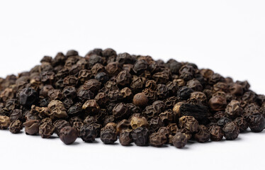 Black pepper on white background. 
Spices.